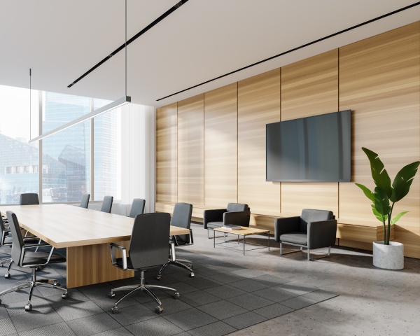 Corner of panoramic meeting room with white and wooden walls, concrete floor, long conference table and lounge area with TV and armchairs. Blurry cityscape. 3d rendering